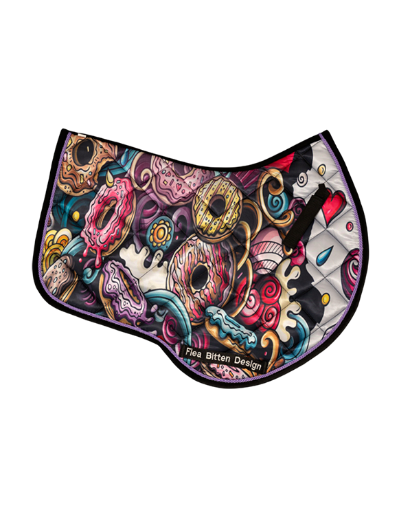 Horse wearing Sweet Tooth saddle pad and ear bonnet.